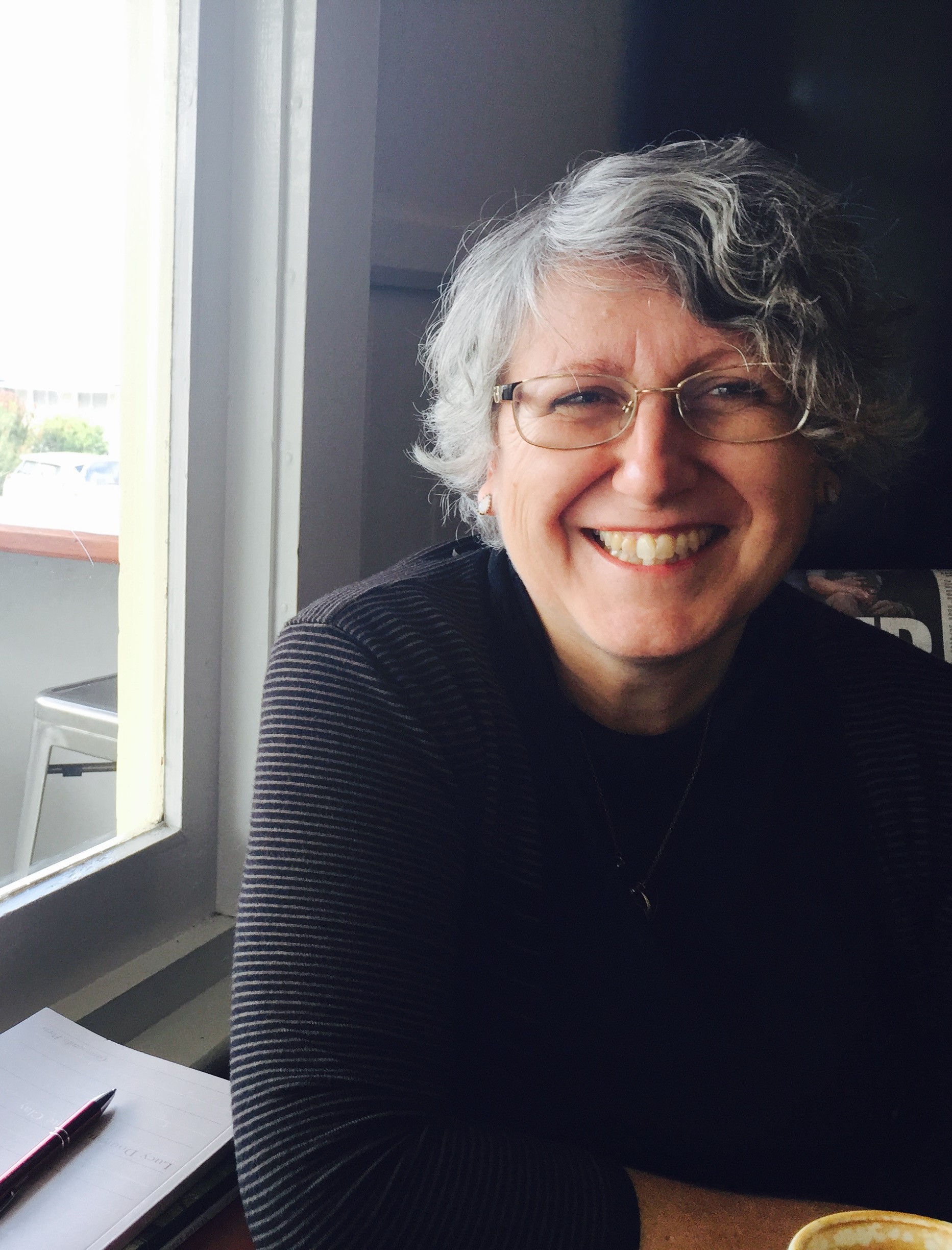 A photo of Lucy Dougan sitting in her window